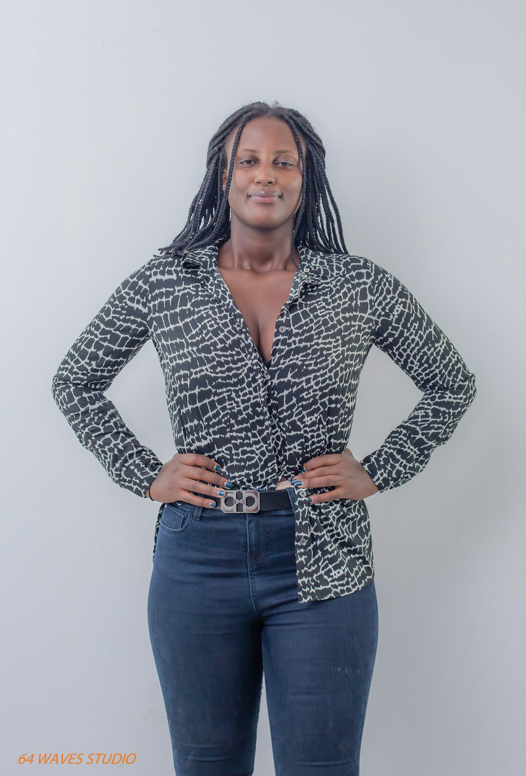 Studio portrait of a smiling woman in business casual attire